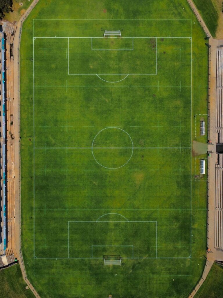 an aerial view of a soccer field in a city